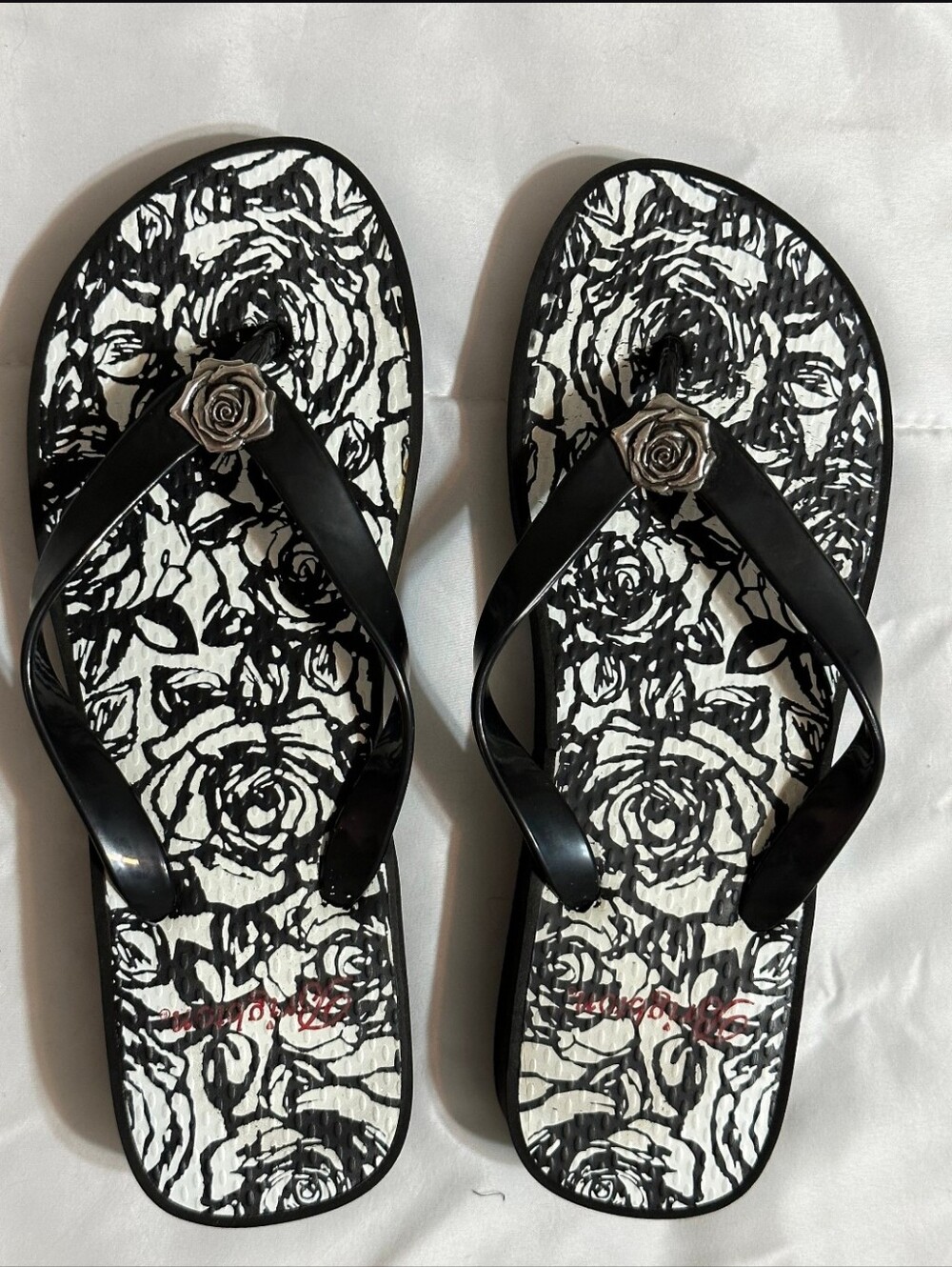 Brighton Malibu Women’s Rose Print Flip Flops with Rose Accent - Black & White